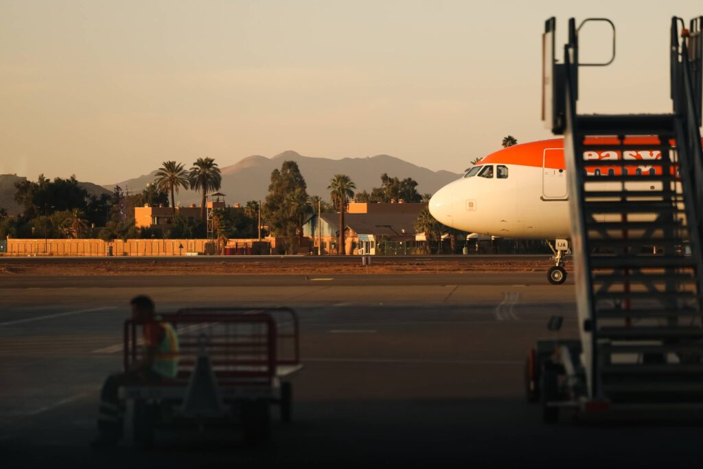 airport-tarmac-airplane-nose-sunset-mountains