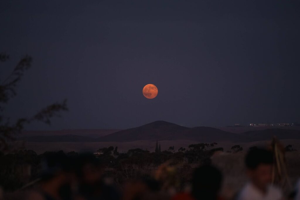 blood-moon-over-mountain-silhouette-nightscape